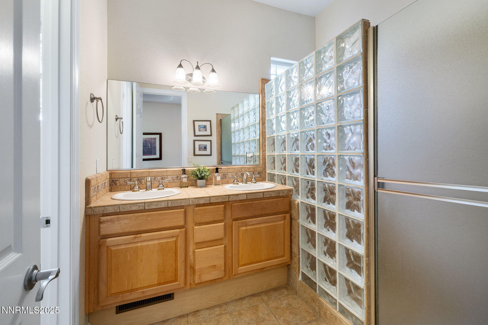 4865 Buckhaven Road Reno, NV 89519 - Photo 30 of 47 a spacious bathroom with a shower sink and mirror
