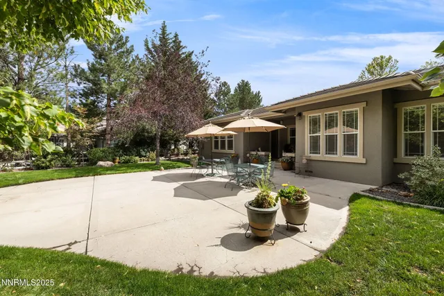 a view of a house with swimming pool and a garden
