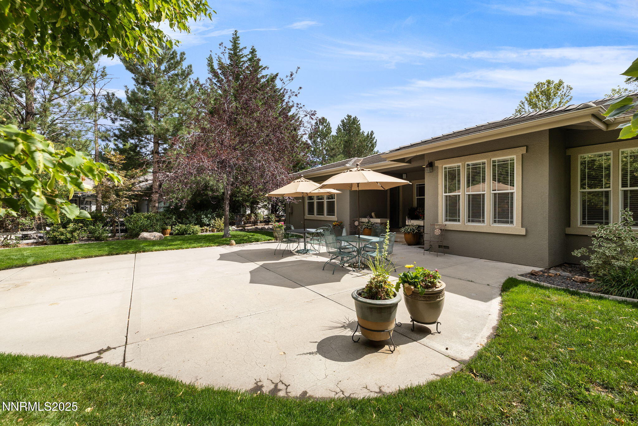 4865 Buckhaven Road Reno, NV 89519 - Photo 3 of 47 a view of a house with swimming pool and a garden