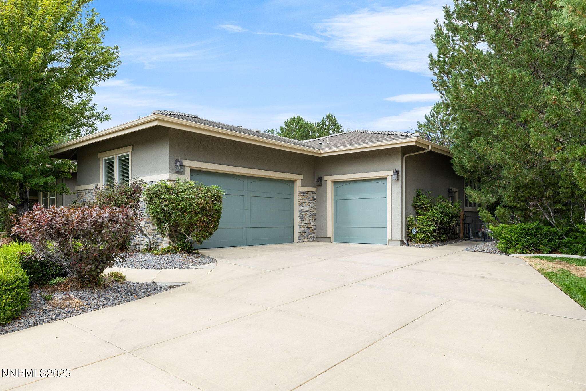 4865 Buckhaven Road Reno, NV 89519 - Photo 35 of 47 a front view of a house with a yard and garage