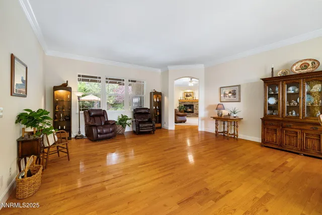 a bedroom with furniture and a large window