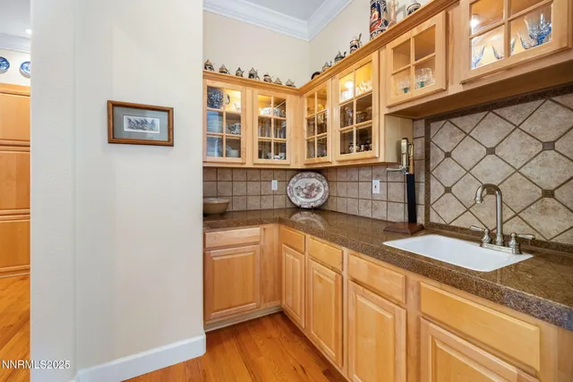 a kitchen with a sink and a refrigerator