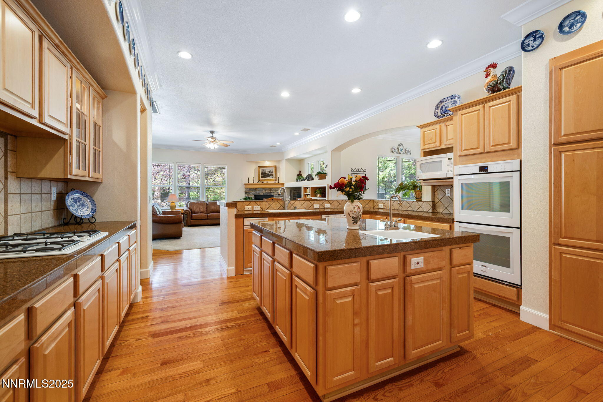 4865 Buckhaven Road Reno, NV 89519 - Photo 10 of 47 a kitchen with stainless steel appliances granite countertop a stove and a refrigerator