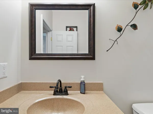 a bedroom with furniture and a large window