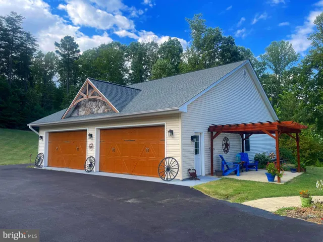 a front view of a house with a yard table and chairs