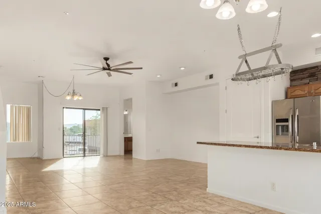 a view of a kitchen with a sink and a window
