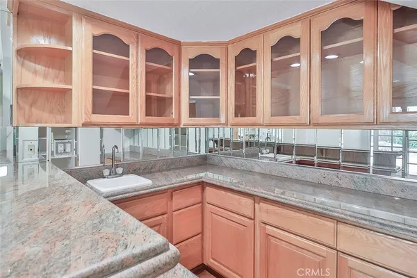 a kitchen with a sink and cabinets