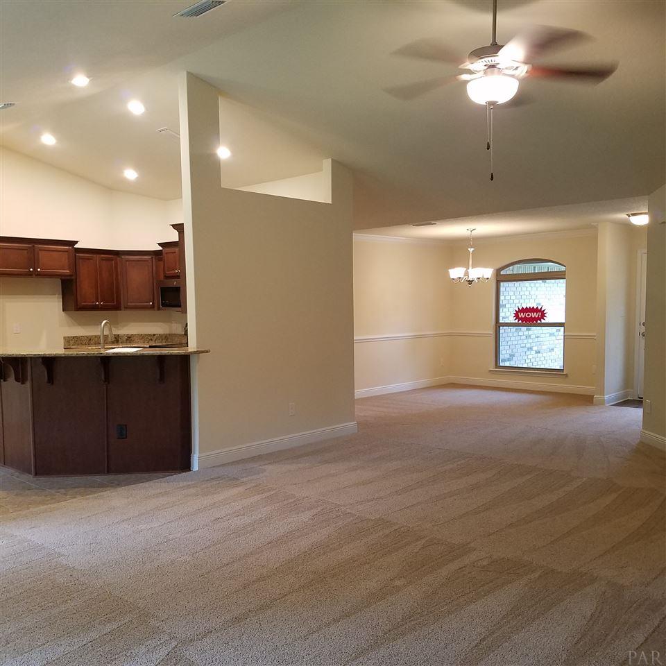 1439 Promenade Loop Cantonment, FL 32533 - Photo 15 of 36 open to the formal dining room and kitchen