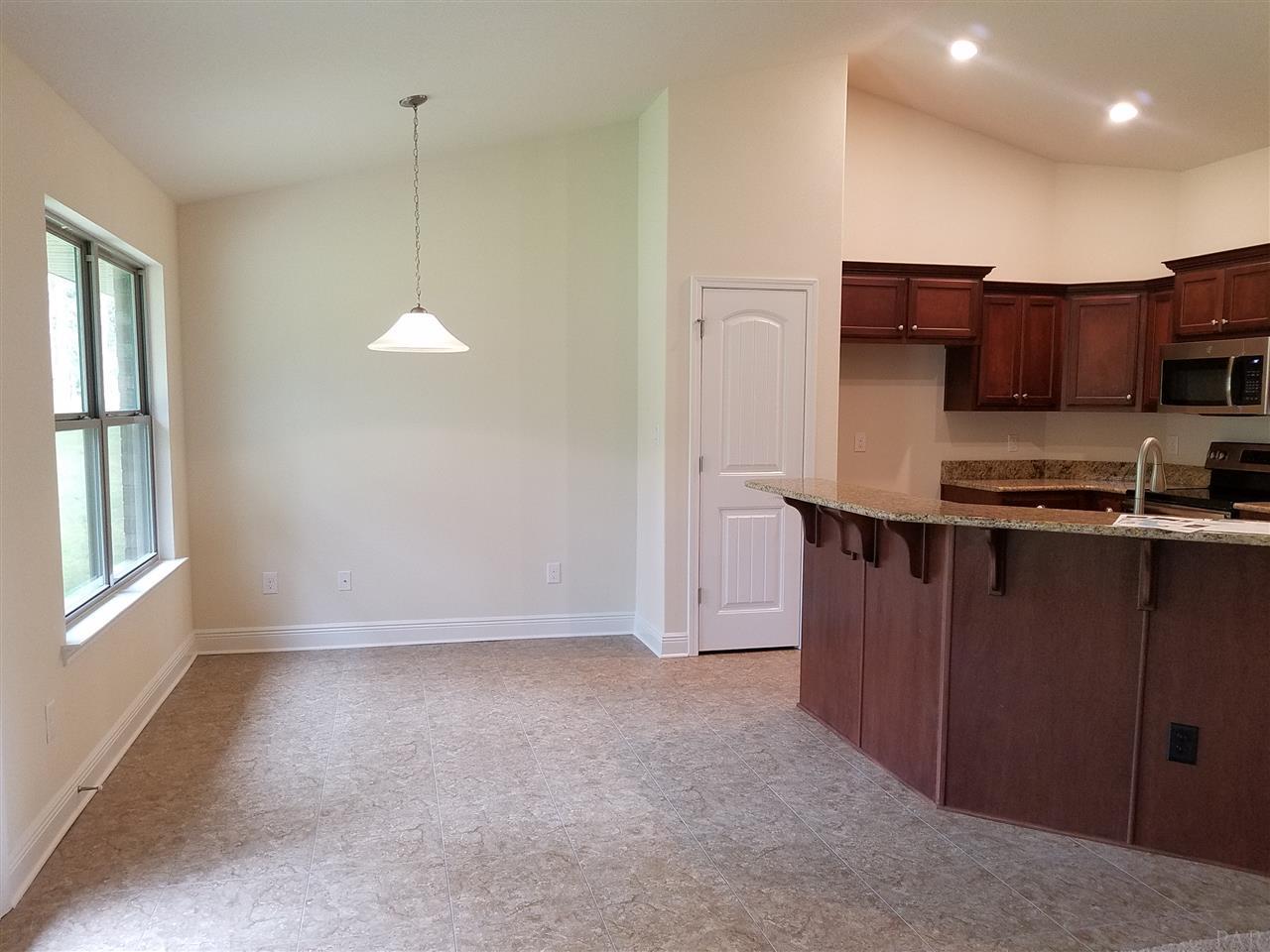 1439 Promenade Loop Cantonment, FL 32533 - Photo 17 of 36 roomy breakfast nook open to the kitchen