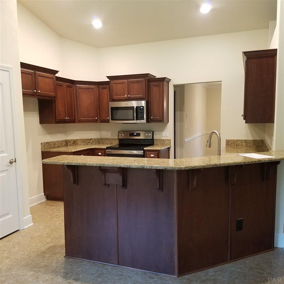 1439 Promenade Loop Cantonment, FL 32533 - Photo 19 of 36 Solid wood cabinets with crown accent