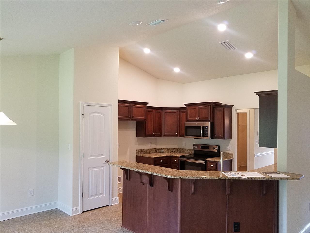 1439 Promenade Loop Cantonment, FL 32533 - Photo 20 of 36 modern recessed LED lighting in the kitchen