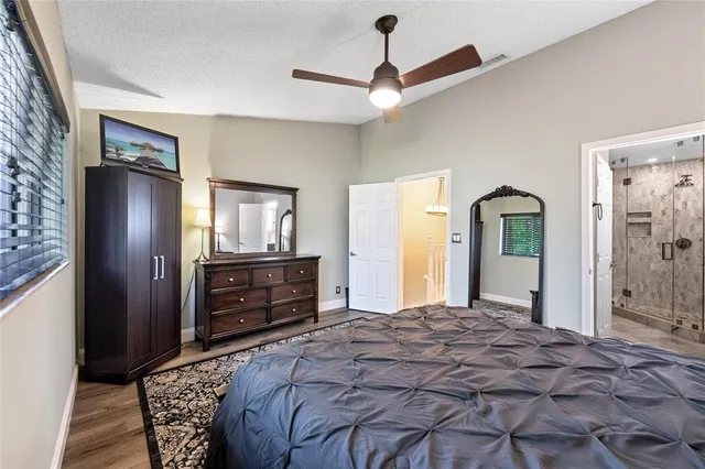 a bedroom with a bed and a dresser