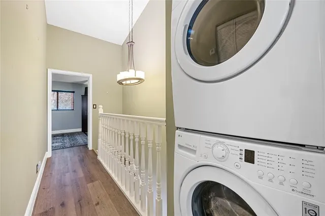 a view of a hallway with washer and dryer