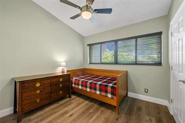 a bed room with a bed and a window