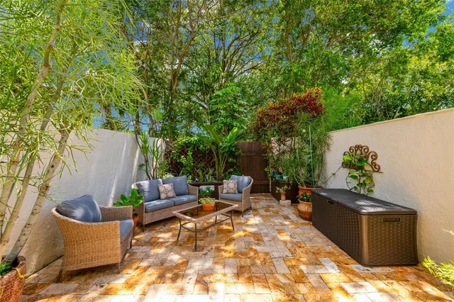 a view of a backyard with sitting area