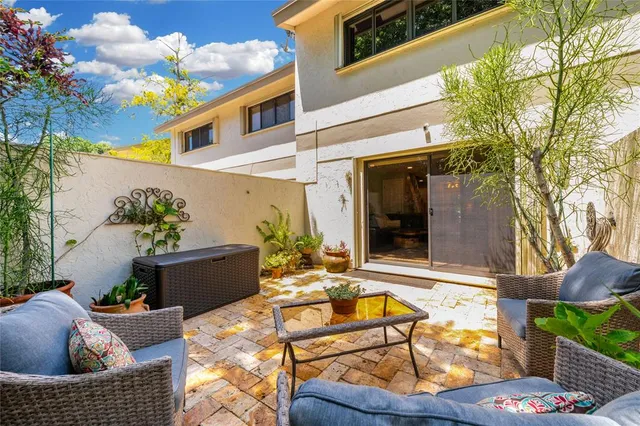 a outdoor living space with furniture and a potted plant