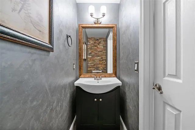 a bathroom with a sink a mirror and a shower