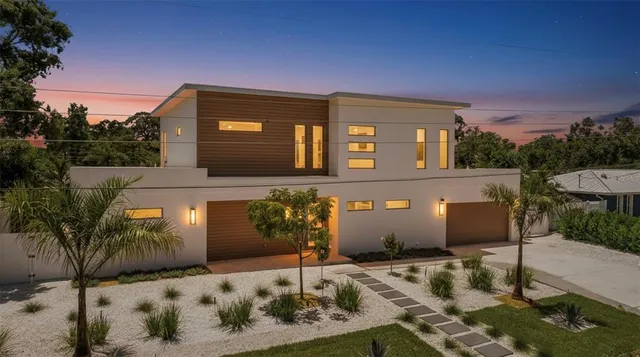 a front view of a house with trees