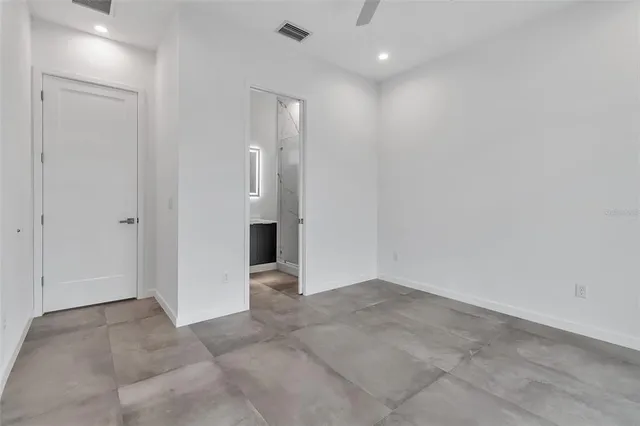 a view of a hallway with closet area