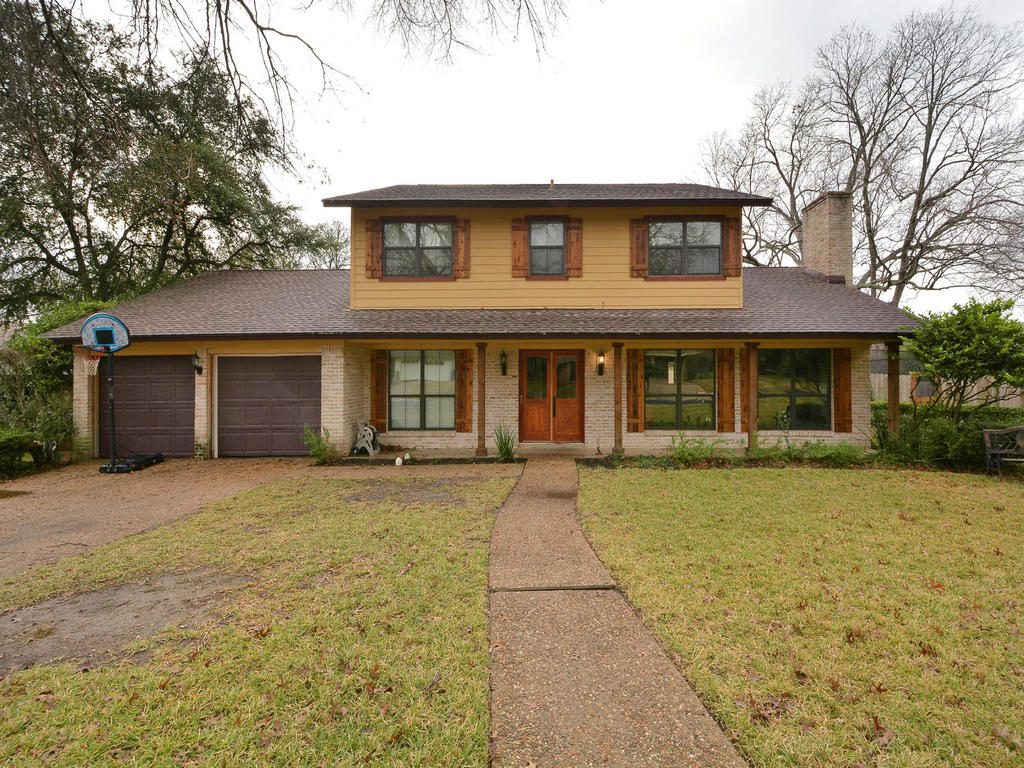 2305 Comburg Castle Way Austin, TX 78748 - Photo 1 of 1 front view of a brick house with a yard