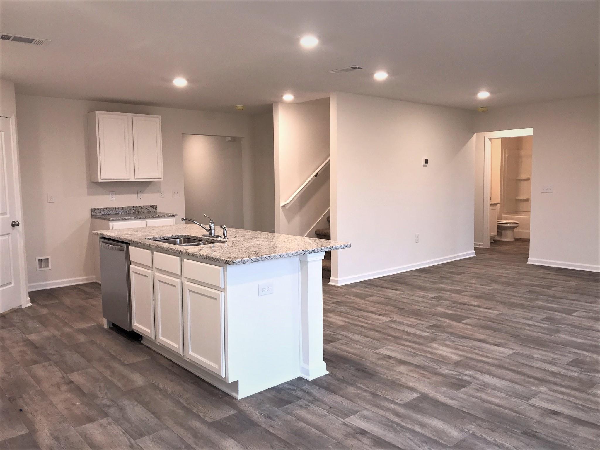 320 Flounder Street Crestview, FL 32539 - Photo 2 of 18 a kitchen that has a lot of white cabinets and stainless steel appliances