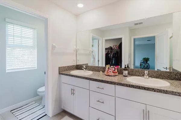 a bathroom with a shower and toilet