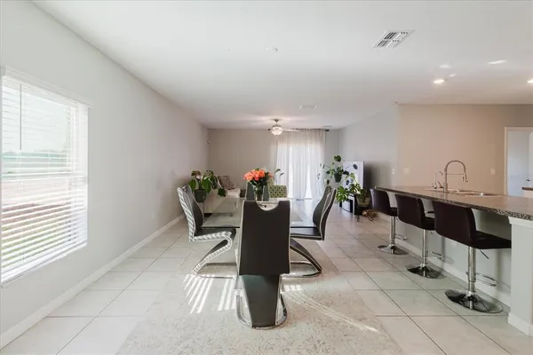 a view of a dining room with furniture window and outside view