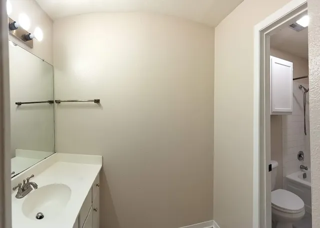 a bathroom with a sink and toilet
