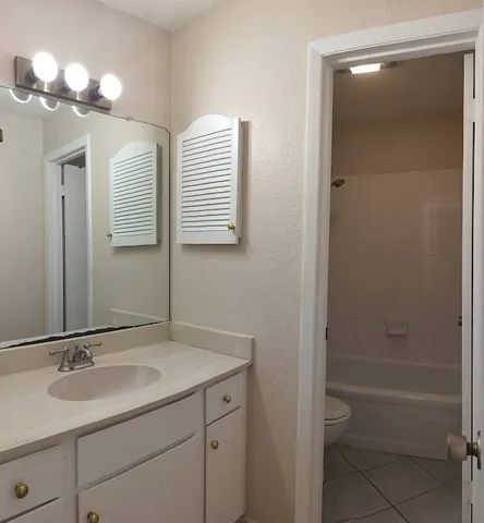 a bathroom with a sink double vanity and a mirror