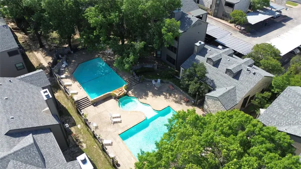 an aerial view of a house with outdoor space