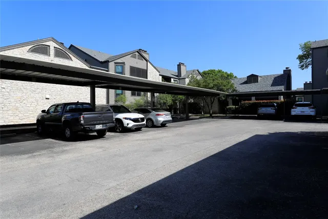 a view of a car parked in front of a house