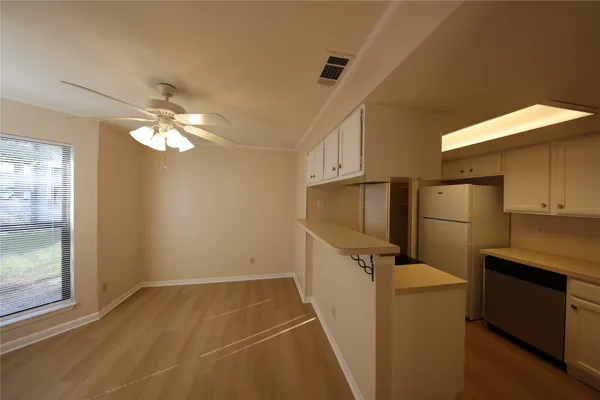 a view of a storage & utility room with a sink