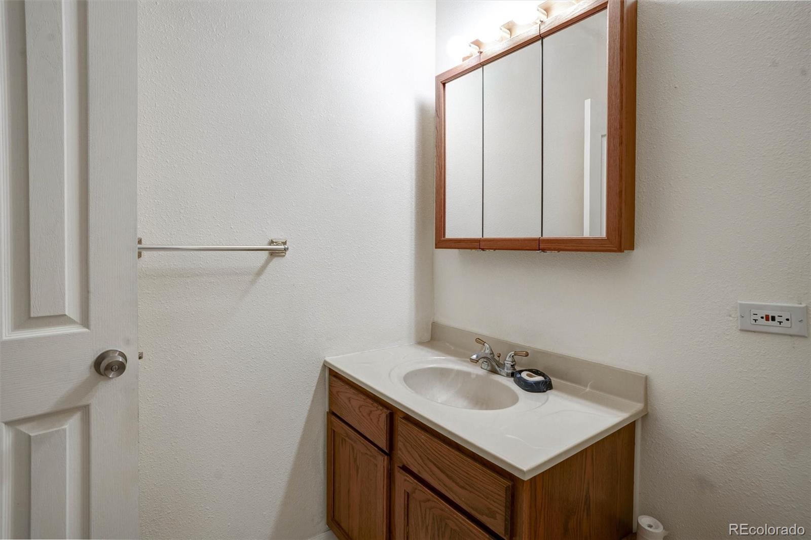 1206 Biddle Street Georgetown, CO 80444 - Photo 8 of 32 a bathroom with a sink and a mirror