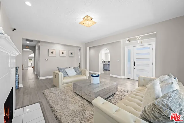 a bedroom with furniture and a chandelier