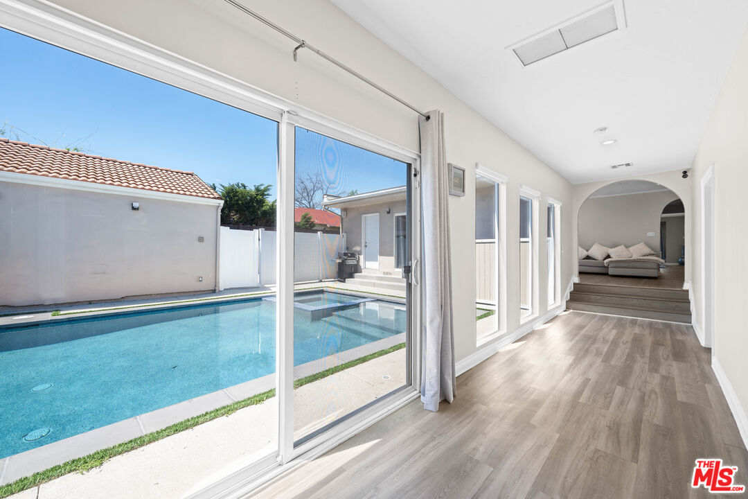15042 Valleyheart Drive Sherman Oaks, CA 91403 - Photo 16 of 31 a view of a living room and hardwood floor