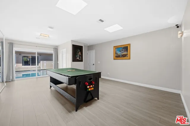 a living room with hard wood floors and a couch