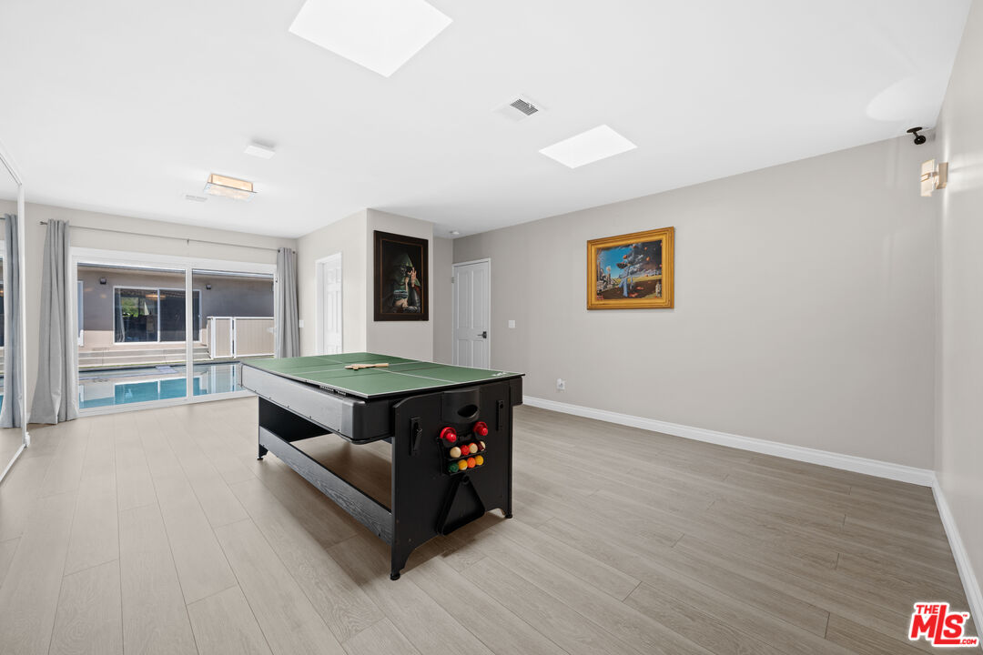 15042 Valleyheart Drive Sherman Oaks, CA 91403 - Photo 20 of 31 a living room with hard wood floors and a couch