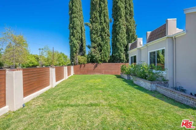 a house view with a garden space