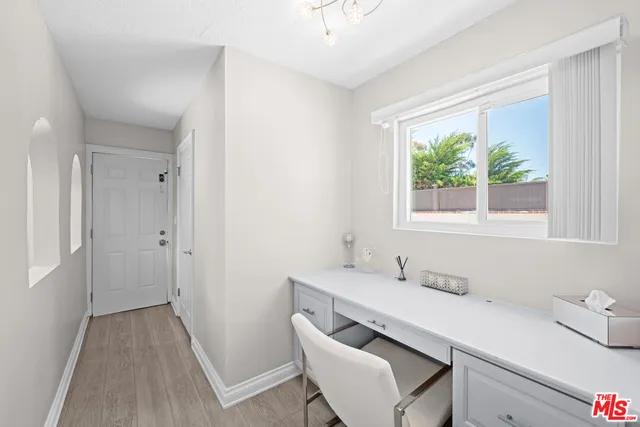 a bathroom with a sink a toilet and a window