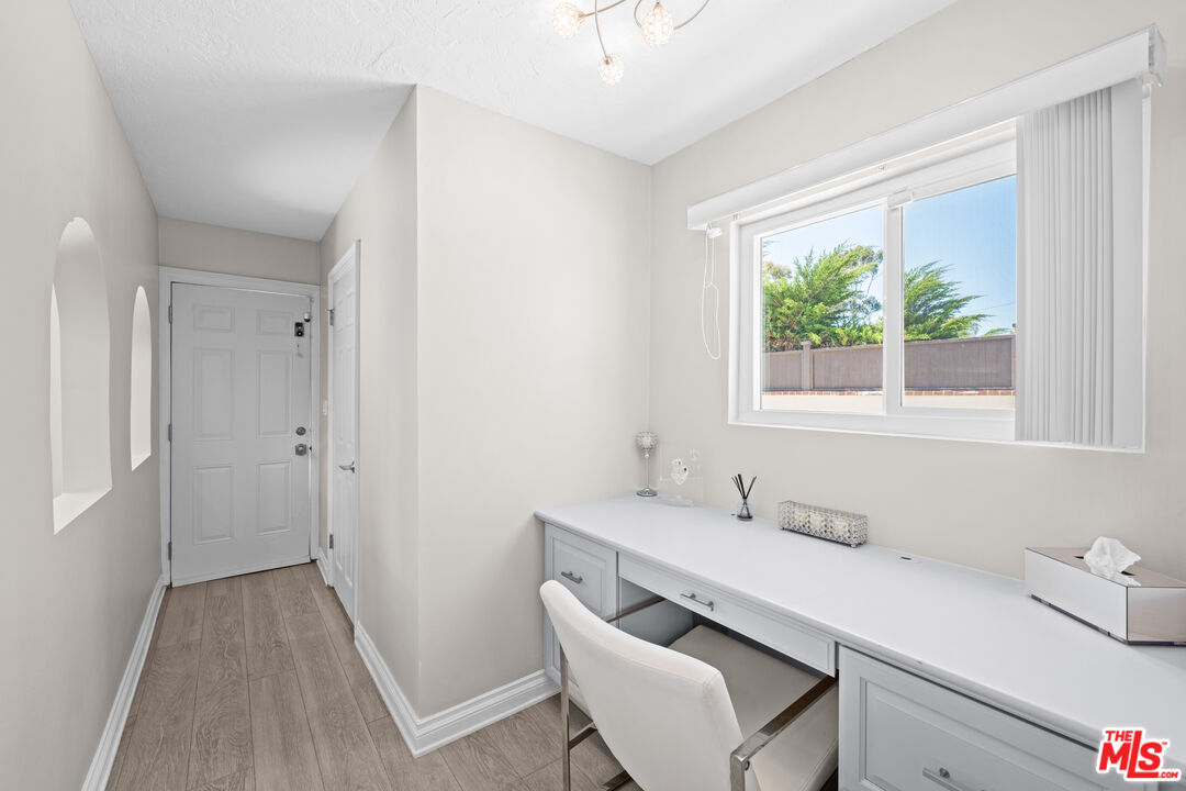 15042 Valleyheart Drive Sherman Oaks, CA 91403 - Photo 9 of 31 a bathroom with a sink a toilet and a window