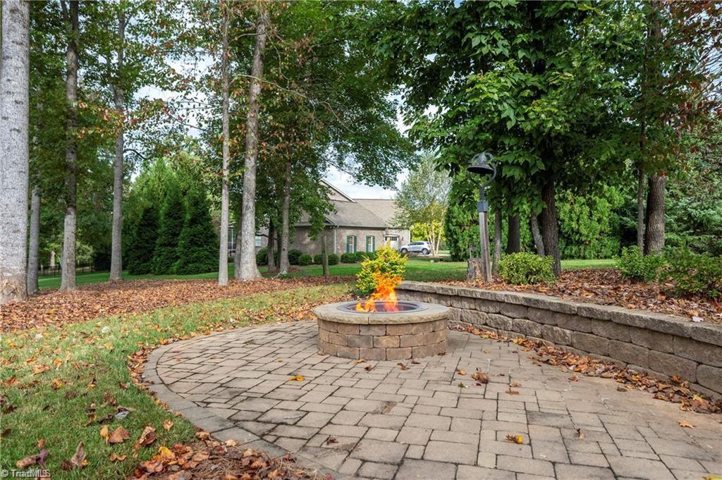 1953 Woodstock Road Clemmons, NC 27012 - Photo 31 of 43 Fire pit off patio and sun porch