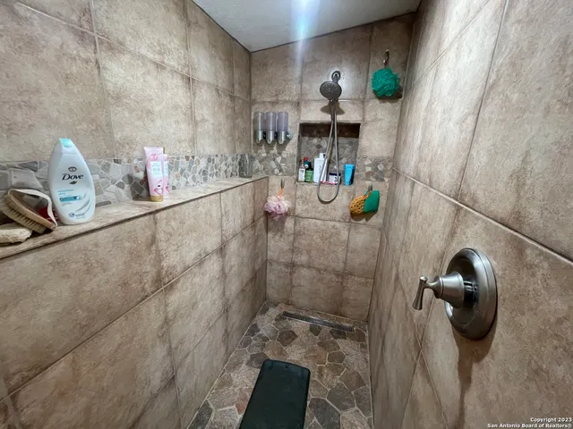 a bathroom with a sink and mirror