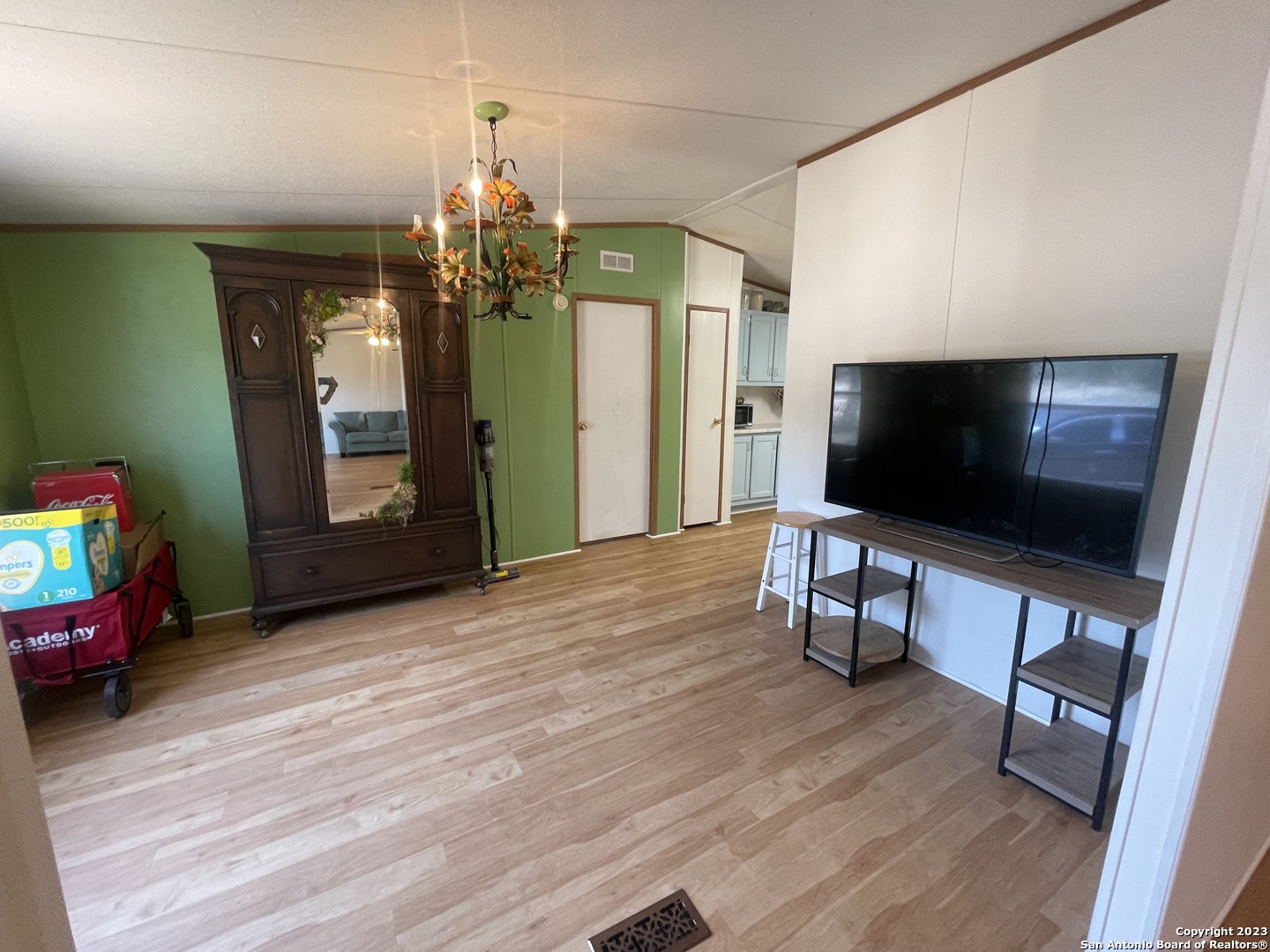 792 Alamo Beach Road, Unit A Pipe Creek, TX 78063 - Photo 13 of 18 a living room with furniture and a flat screen tv