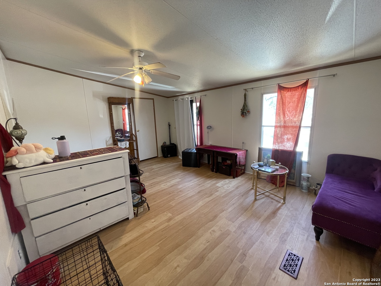 792 Alamo Beach Road, Unit A Pipe Creek, TX 78063 - Photo 4 of 18 a bed room with furniture and a window