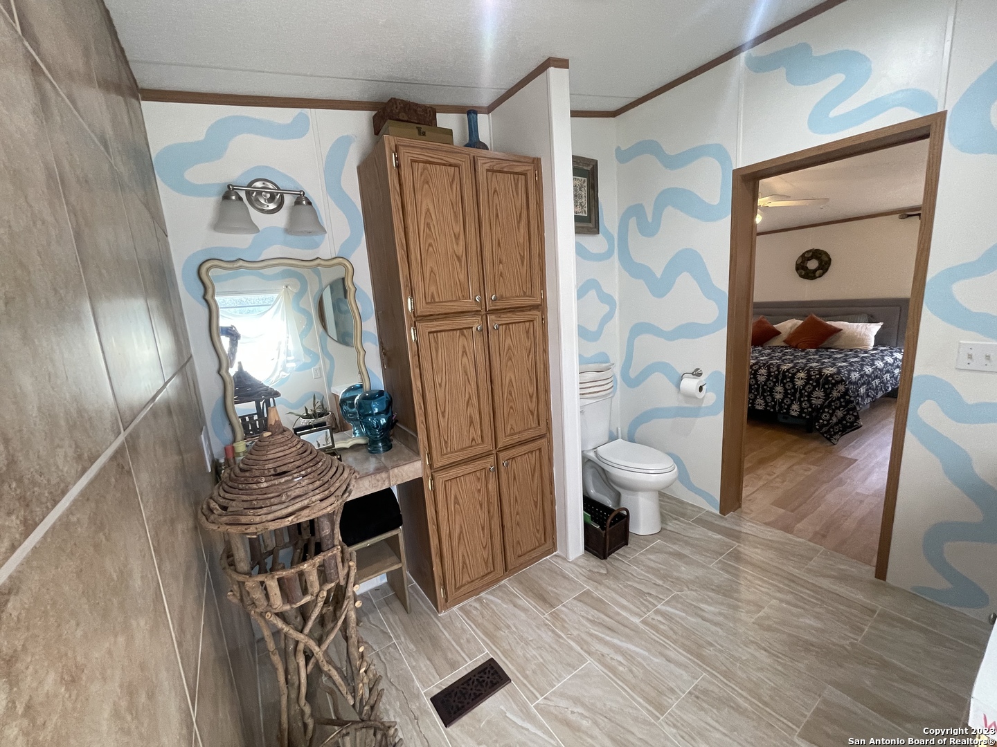 792 Alamo Beach Road, Unit A Pipe Creek, TX 78063 - Photo 7 of 18 a living room with furniture and a wooden floor