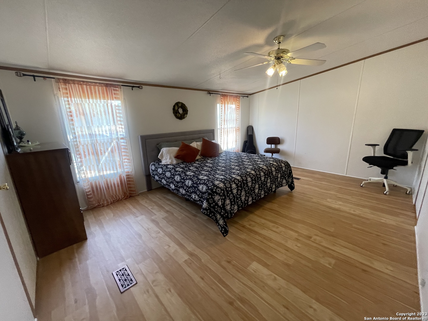 792 Alamo Beach Road, Unit A Pipe Creek, TX 78063 - Photo 9 of 18 a bedroom with a bed window and a mirror