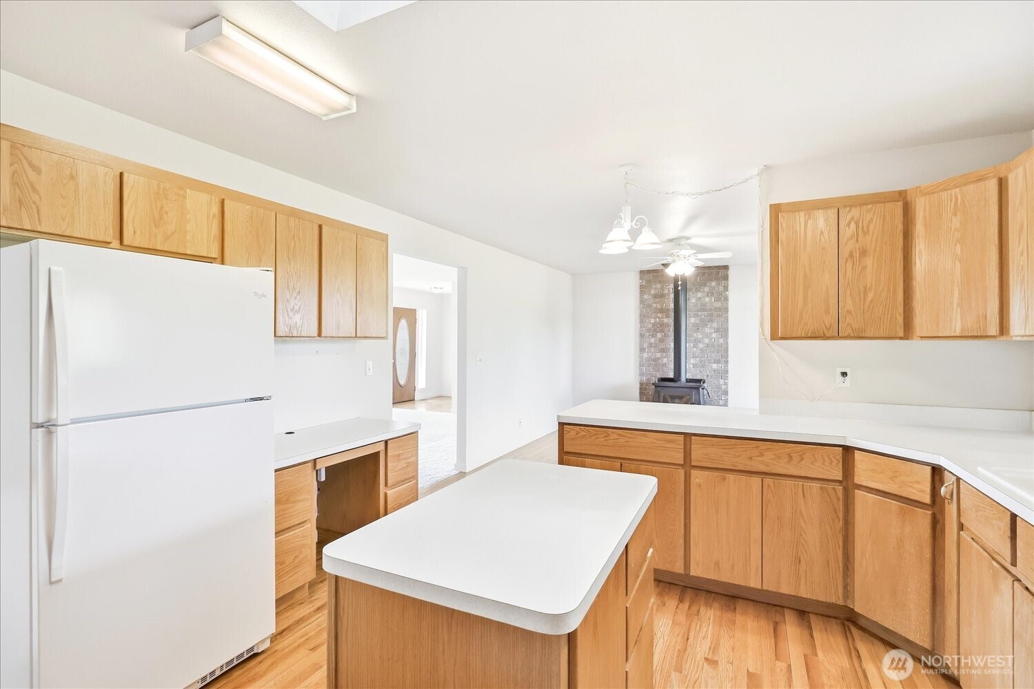221 Shane Porter Road Walla Walla, WA 99362 - Photo 11 of 38 a kitchen with a sink a stove a refrigerator and a window