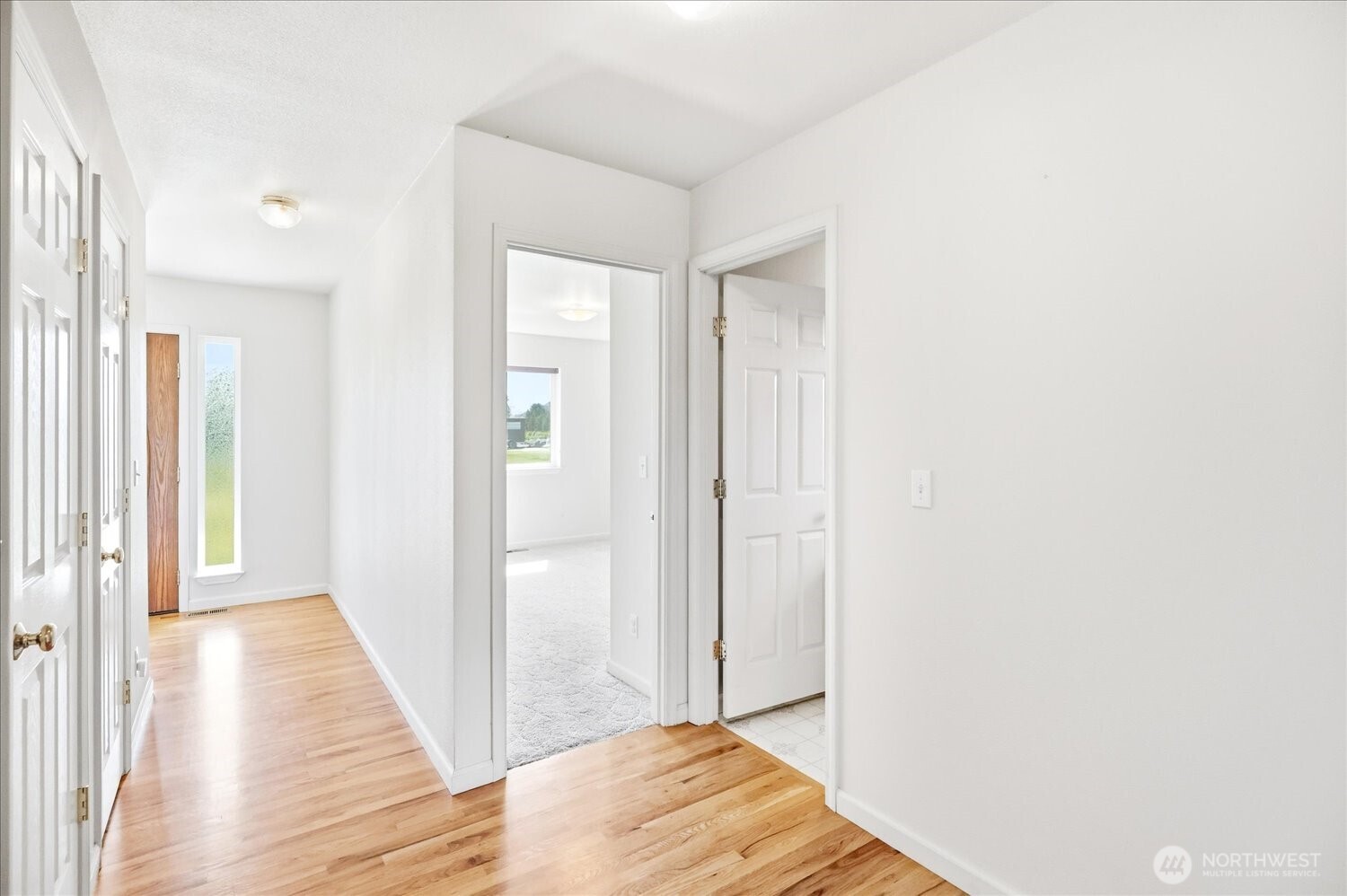 221 Shane Porter Road Walla Walla, WA 99362 - Photo 12 of 38 a view of a hallway with wooden floor and staircase
