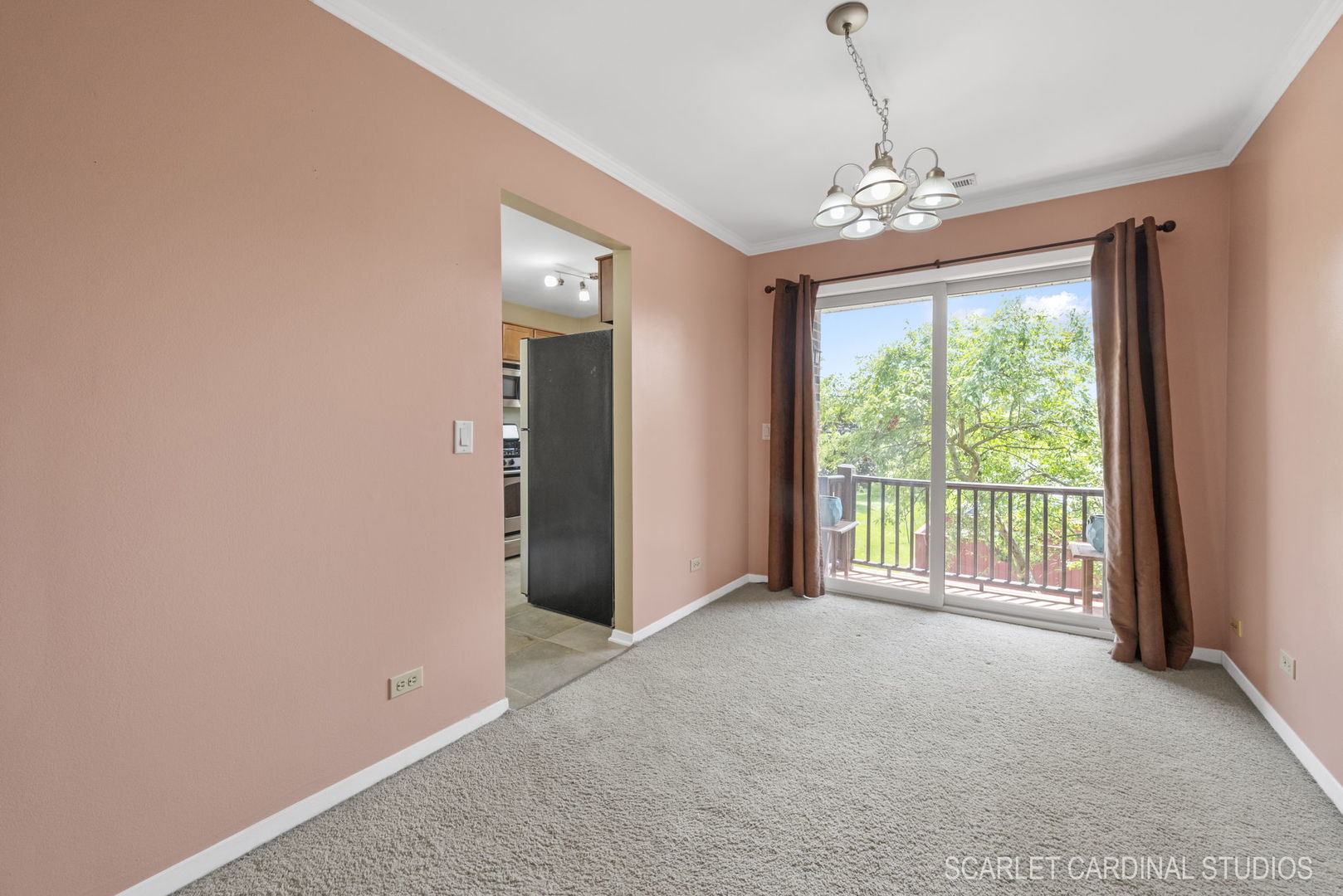 1300 McDowell Road, Unit 203 Naperville, IL 60563 - Photo 11 of 21 a view of a livingroom with a chandelier curtains and large windows
