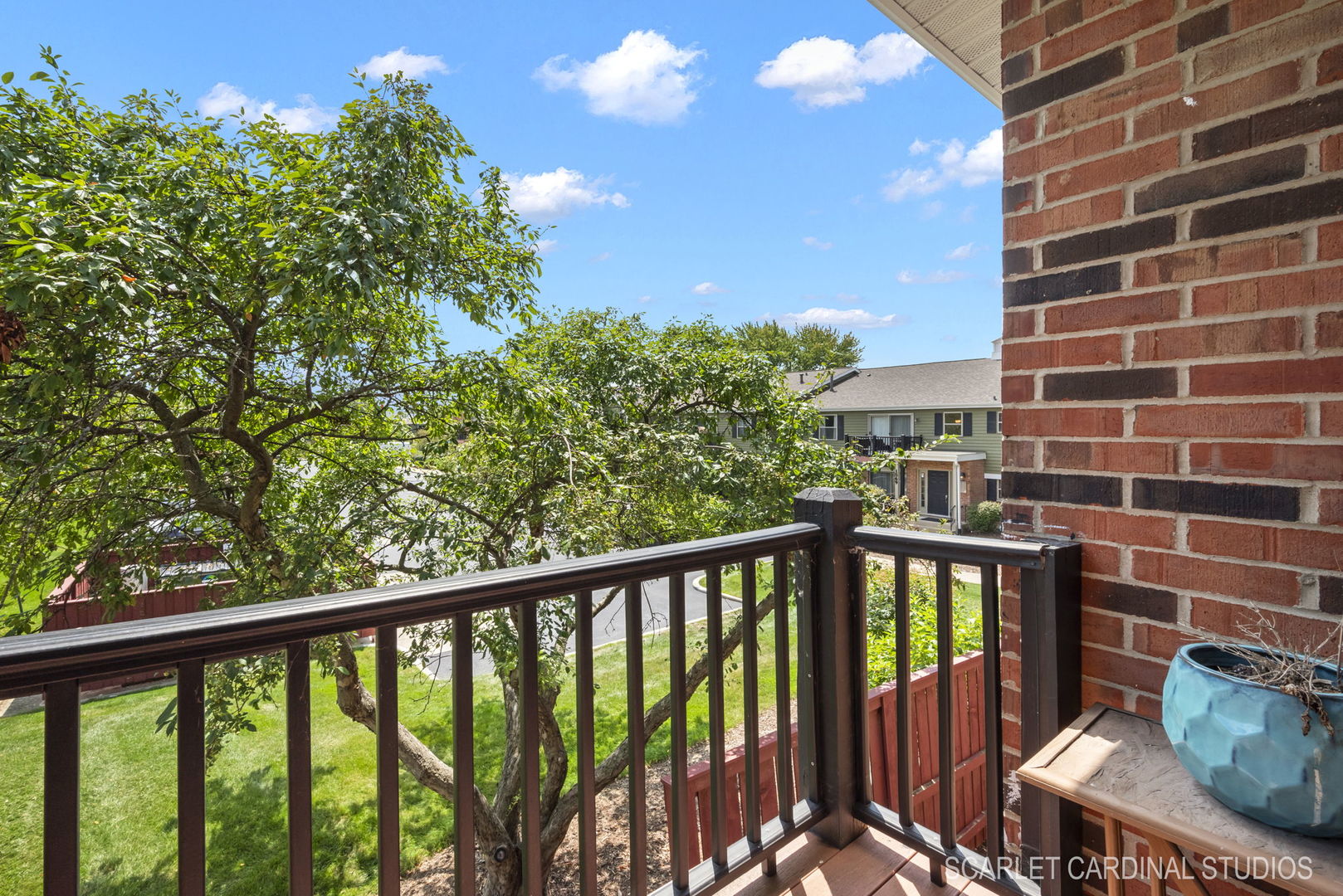 1300 McDowell Road, Unit 203 Naperville, IL 60563 - Photo 18 of 21 a view of a balcony with wooden fence and floor